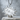 Manga Dokan Impact Pendant, polished silver, front view on stone pedestal