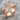 Cracked Cathedral Ring, rose gold, resting on stone