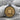 Lion Medallion Pendant, two-tone finish, product photo on stone