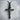 INRI Crucifix Pendant, black rhodium, front view on stone pedestal