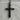 Forged Cross Pendant, black rhodium, front view on stone display
