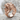 Snarling Tiger Ring, rose gold, angled view on stone