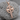 Beveled Celtic Cross Pendant, rose gold, product photo on textured stone