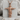 Open Arms Jesus Pendant, rose gold, front view on stone display