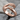 Embracing Hands Hug Ring, rose gold, product photo on stone surface