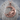 Crescent Moon Face Pendant, rose gold, front view on stone