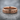 Believe Band Ring, rose gold, front view resting on stone surface