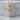 Leaf Cross Pendant, rose gold, product photo on stone pedestal