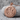 Libra Skull Pendant, rose gold, front view resting on stone