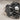 Pirate Crossbones Skull Ring, oxidized, angled close-up view of skull and scrollwork
