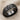 Celtic Trinity Knot Ring, black rhodium, angled product photo on fabric