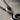 Treble Clef Note Pendant, oxidized silver, close-up of the upper loop and bail