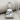 Meditation Buddha Pendant, polished silver, front product view on fabric