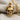 Military skull pendant, gold vermeil, front view on fabric