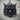 Horned Oni Mask Ring, black rhodium, front view on wood surface