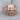 Scroll Skull Ring, rose gold, front product view on wood