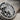 Extreme close up of hand finished cobra head fangs and skull bed details on oxidized sterling silver ring