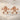 Bone Flower Earring, rose gold, pair displayed on stone surface