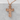 Corpus Christi Crucifix Pendant, rose gold, front view against grey stone