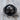 Trepanation Signet Ring, black rhodium, product photo on wood surface