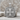 Acanthus Scroll Cross Pendant, polished silver finish, product view on stone