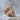 Sitting Squirrel Pendant, rose gold, product photo on stone