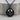 Memento Mori Skull Medallion Pendant, product photo in black rhodium