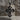 Praying Virgin Mary Cross Pendant, black rhodium, front view on stone