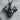Double Bicep Bodybuilder Pendant, black rhodium, product photo on display block