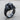 Elephant Head Ring, black rhodium, angled view on wood