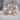 Sun and Moon Mismatched Earring, rose gold, front pair on textured stone