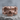Jawless Skull Band Ring, rose gold, product photo on stone surface