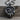 Mountain Bear Paw Pendant, black rhodium, product photo on wood surface