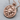 Scorpio Zodiac Medallion Pendant, rose gold, angled view on wood surface with chain
