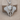 Layered Elephant Pendant in polished silver, front view on wood block