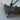 Winged Arrow Pendant, black rhodium, angled view on wood block