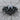 Tribal Biker Skull Ring, black rhodium, front view on wood surface