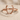 Wishbone Deer Antler Ring, rose gold, front view on sand