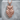 Celtic Owl Pendant, rose gold, front view on stone pedestal