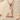 Braided Viking Axe Pendant, rose gold, angled view on sand
