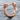 Twin skull earring, rose gold plated finish, product photo