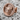Minotaur Stud Earring, rose gold, front view on stone