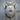 Roaring Grizzly Bear Pendant, polished silver, front view on wood block