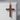 Ruby cross pendant, rose gold, front product view on stone pedestal