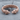 Geri Freki Rope Bracelet in rose gold, product photo on stone
