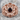 Garnet Rosette Pinky Ring in rose gold finish, angled studio product photo