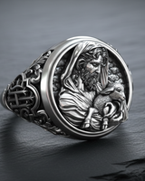 Front view of the Silver Christian Shepherd Ring featuring a detailed relief of Jesus holding a lamb, set on a slate stone.