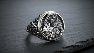 Front view of the Silver Christian Shepherd Ring featuring a detailed relief of Jesus holding a lamb, set on a slate stone.