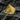 Close-up of the All Seeing Eye ring resting on a dark textured rock, showcasing intricate eye and ray engravings