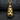 Close-up of the 14K gold vermeil astronaut moon pendant on a dark background detailing the textured craters